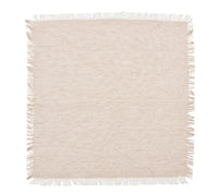 A set of four rectangular beige napkins with fringed edges on all sides, crafted by Kim Seybert, featuring a charming texture inspired by blue chambray linen—perfect for complementing farmhouse table decor.