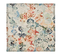 The Giverny Napkin Set of 4 by Kim Seybert features square linen napkins with an abstract floral pattern in watercolor-inspired orange, blue, green, and beige tones, lending a Monet-inspired artistic touch to your table.