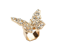 The Kim Seybert Papillon Butterfly Napkin Ring Boxed Set of 4 features gold butterfly designs with clear gemstones, shown on a white background—ideal for elevating any table setting with a touch of luxury.