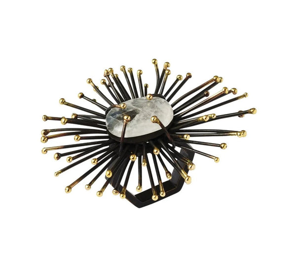 The Kim Seybert Flare Napkin Ring Black & Gold Set of 4 features a handmade starburst design with a central translucent stone, radiating black metal spokes, and gold sphere accents.