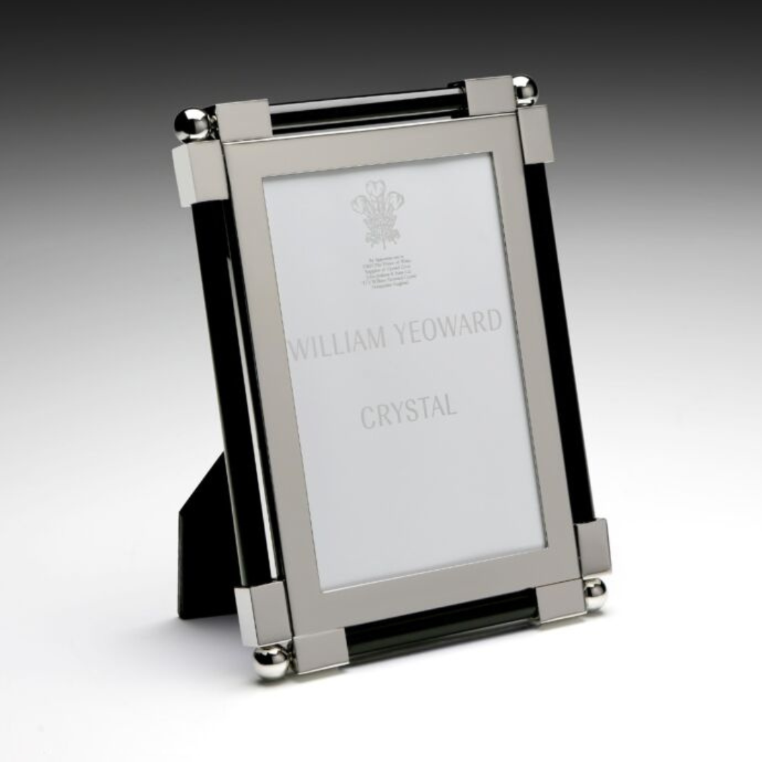 Showcase your cherished memories with the William Yeoward New Classic Black Frame, a stylish black photo frame perfect for any setting.