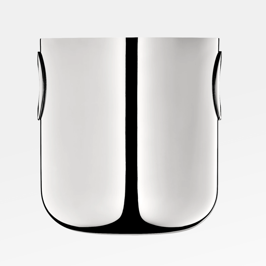 The Christofle Oh De Stainless Steel Champagne Bucket features a polished, reflective finish, rounded edges, and two subtle side handles—an iconic barware essential—shown against a plain white background.