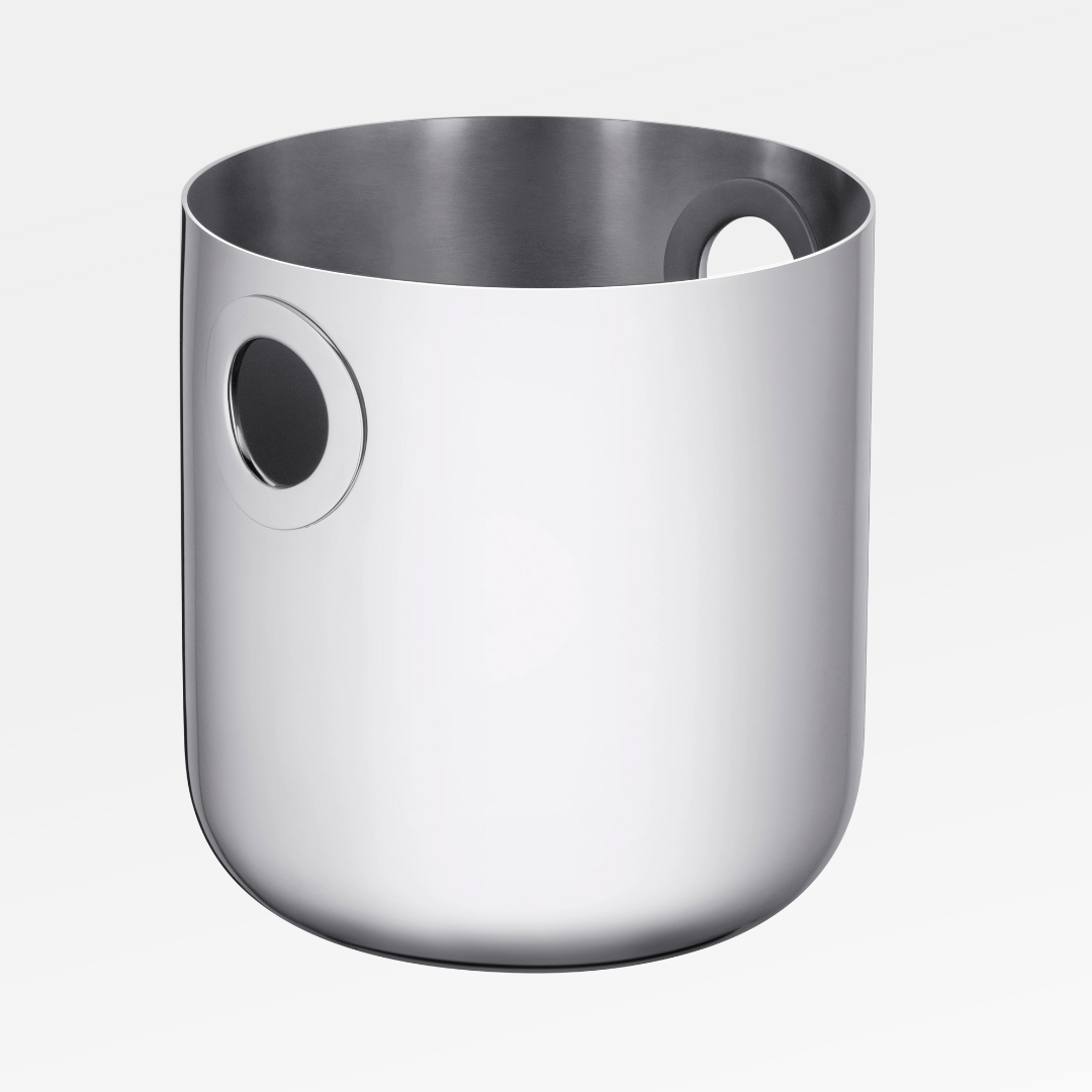 The Christofle Oh De Stainless Steel Champagne Bucket is a sleek, cylindrical barware essential with a smooth finish and two round handle openings near the top, shown against a plain white background.
