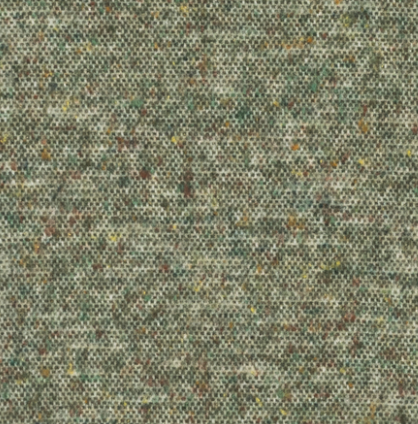Close-up of the Lands Downunder Cinder Mist Throw, featuring a textured green fabric with specks of yellow, brown, and gray that create a mottled, multi-colored appearance reminiscent of a modern throw. The visible weave and individual threads give this cotton wool silk throw a slightly rough look.