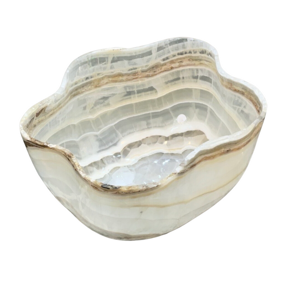 The Verona Prive Onyx Patina Centerpiece Bowl features a wavy edge, beige and white natural striations, a polished finish, hand-carved luxury design, and includes a drain hole at the bottom.