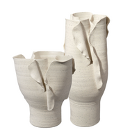 The Jamie Young Tublar Vases feature sculptural, off-white ceramic forms with wavy edges and organic layers—modern statement pieces that bring elegant style to any space.
