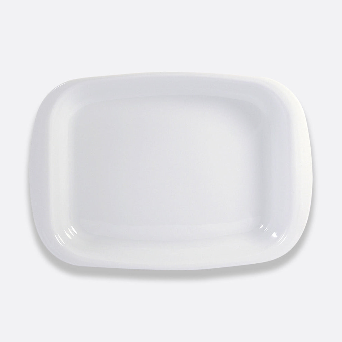 A rectangular white ceramic plate from Bernardaud’s Origine Dinnerware collection is photographed from above on a light gray background.