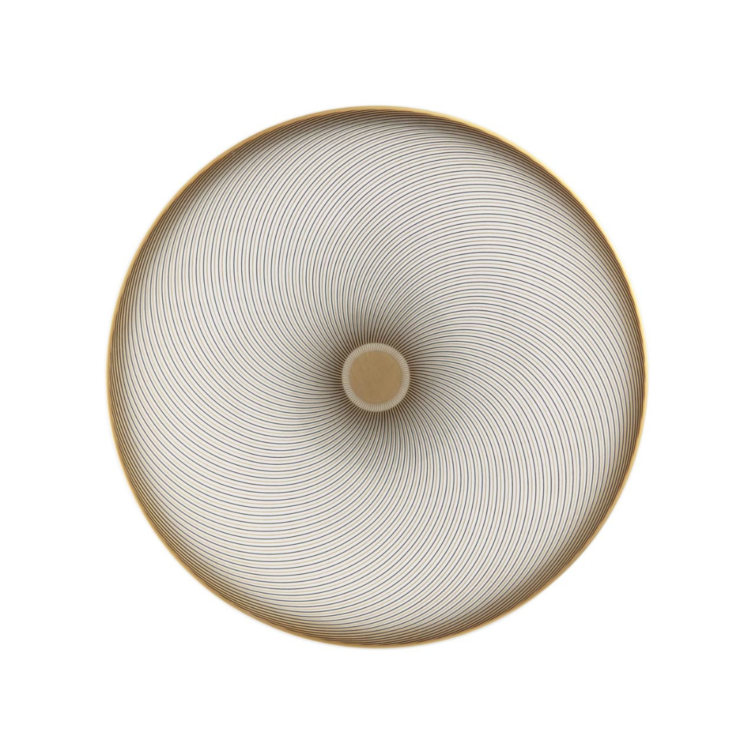 Thin golden lines form a circular geometric design spiraling from a beige center on white, creating a hypnotic effect on the Oskar Dinnerware by Raynaud, reminiscent of fine Limoges porcelain patterns.