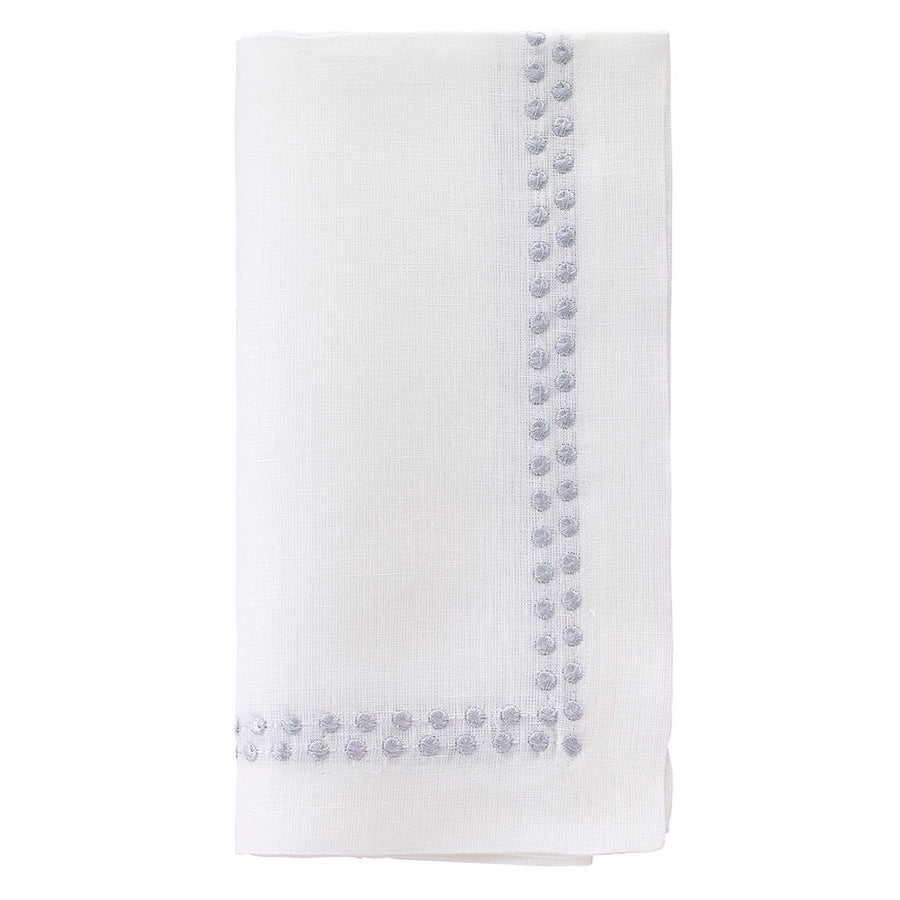 The Bodrum Pearls Napkin Silver Set of 4 is crafted from fine linen and features small, evenly spaced silver embroidered dots along two edges.