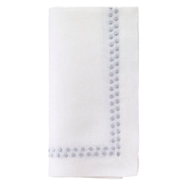 The Bodrum Pearls Napkin Silver Set of 4 is crafted from fine linen and features small, evenly spaced silver embroidered dots along two edges.
