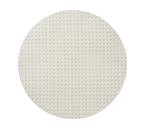 The Kim Seybert Reed Placemats Set of 4 in white features round, flat wafers with a grid-style woven cane pattern, photographed on a plain white background.