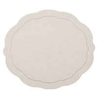 The Kim Seybert Tailored Placemat Set of 4 in Ivory features round, cream-colored faux leather mats with scalloped edges and a subtle stitched border, shown on a white background.