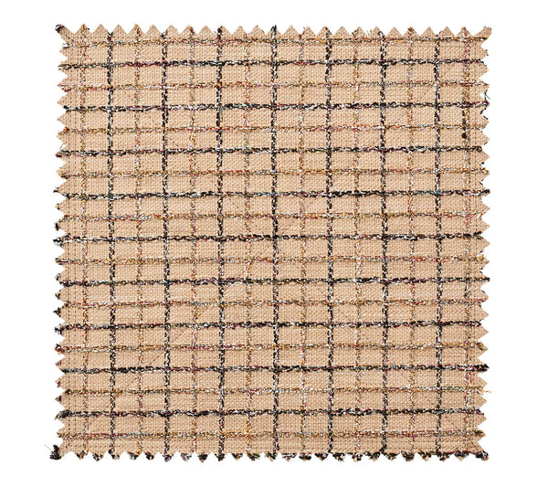 A square Kim Seybert Boucle Reversible Placemat - Brown / Multi swatch with pinked edges, featuring a tan grid pattern with dark textured lines.