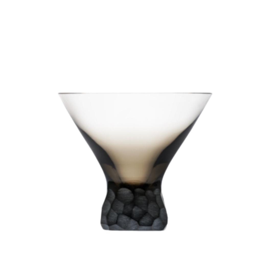 The Moser Pebbles Cocktail Glass 250ml features a wide mouth, smoky gradient from clear to dark, and a textured pebble-like base.