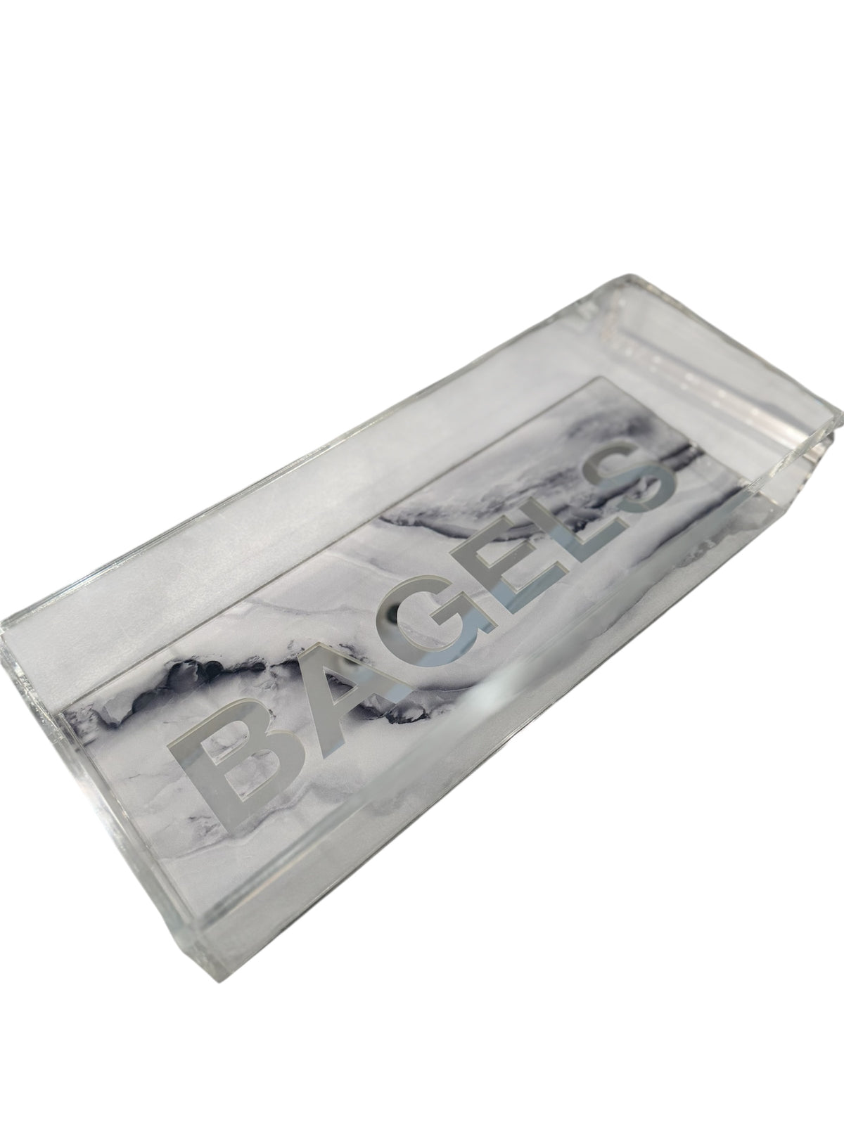 The Eye Candy Bagel Tray is a rectangular, food-safe acrylic tray with a silver marble base and "BAGELS" printed in large silver letters across the bottom.
