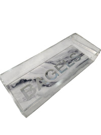 The Eye Candy Bagel Tray is a rectangular, food-safe acrylic tray with a silver marble base and "BAGELS" printed in large silver letters across the bottom.