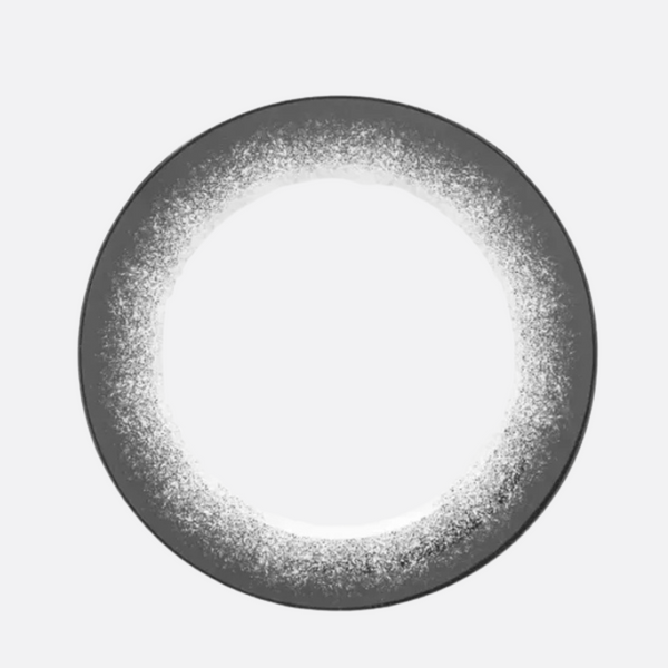 The Poc A Poc Platinum Edge plate is round and dark gray with a white frosted ring around its rim, a light center, and evokes the elegance of French dinnerware. This handcrafted piece is shown against a light gray background.