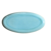 The Plume Ocean Blue plate by Jars - Rosenthal is an oval ceramic piece with artisanal craftsmanship, a glossy finish, and a subtle gradient pattern, shown from above on a white background.