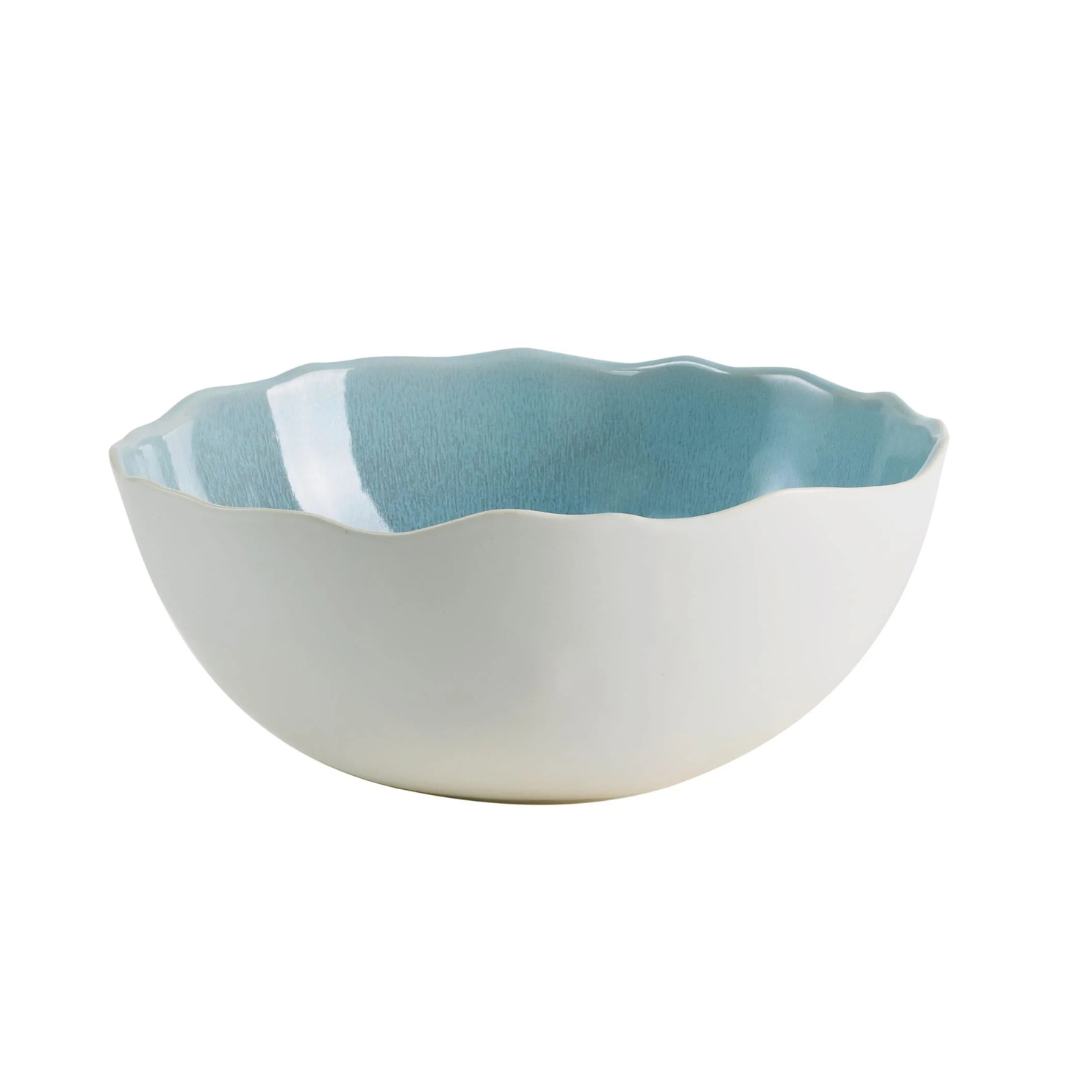 The Plume Ocean Blue bowl by Jars - Rosenthal features a wavy rim with a white exterior and light blue interior, reflecting artisanal craftsmanship—an elegant addition to any dinnerware collection. Pictured on a white background.