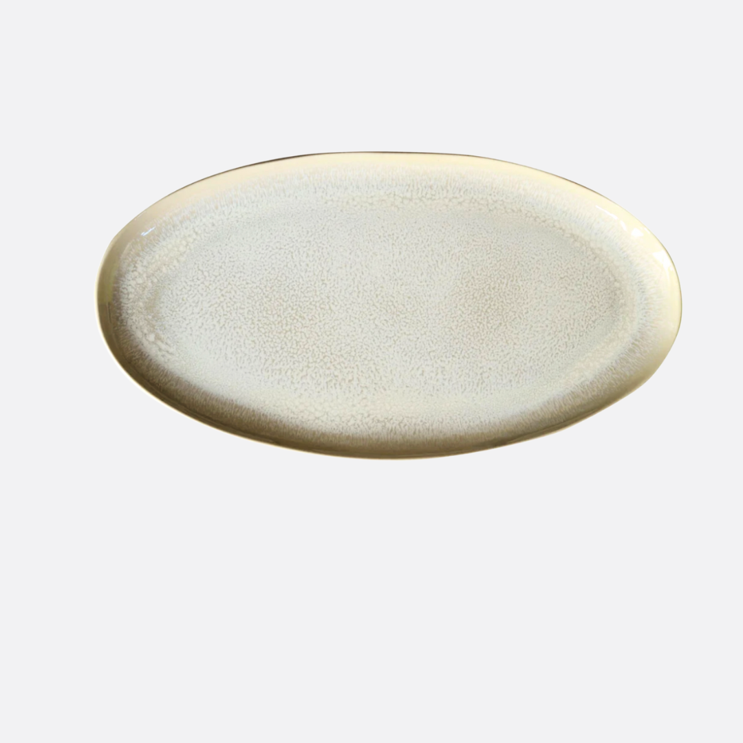 The Plume White Dinnerware Pearl oval platter by Jars - Rosenthal features a subtle speckled pattern and light beige rim, shown on a plain white background.