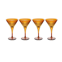 The Prism Martini Set of 4 by L'Objet features four fluted, amber-colored glasses from a striking collection, arranged in a row against a plain white background.