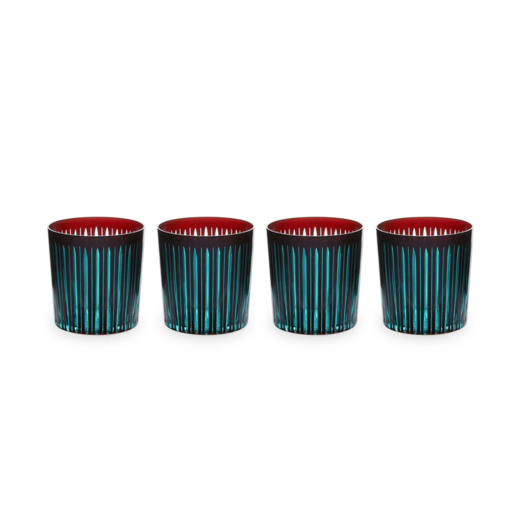 The Prism DOF Set of 4 by L'Objet features hand-cut glass tumblers with vertical turquoise stripes and a vivid red interior, beautifully arranged on a white background—ideal for fans of bold, colorful designs.