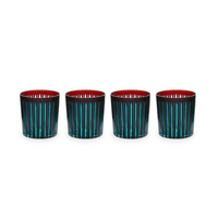 The Prism DOF Set of 4 by L'Objet features hand-cut glass tumblers with vertical turquoise stripes and a vivid red interior, beautifully arranged on a white background—ideal for fans of bold, colorful designs.