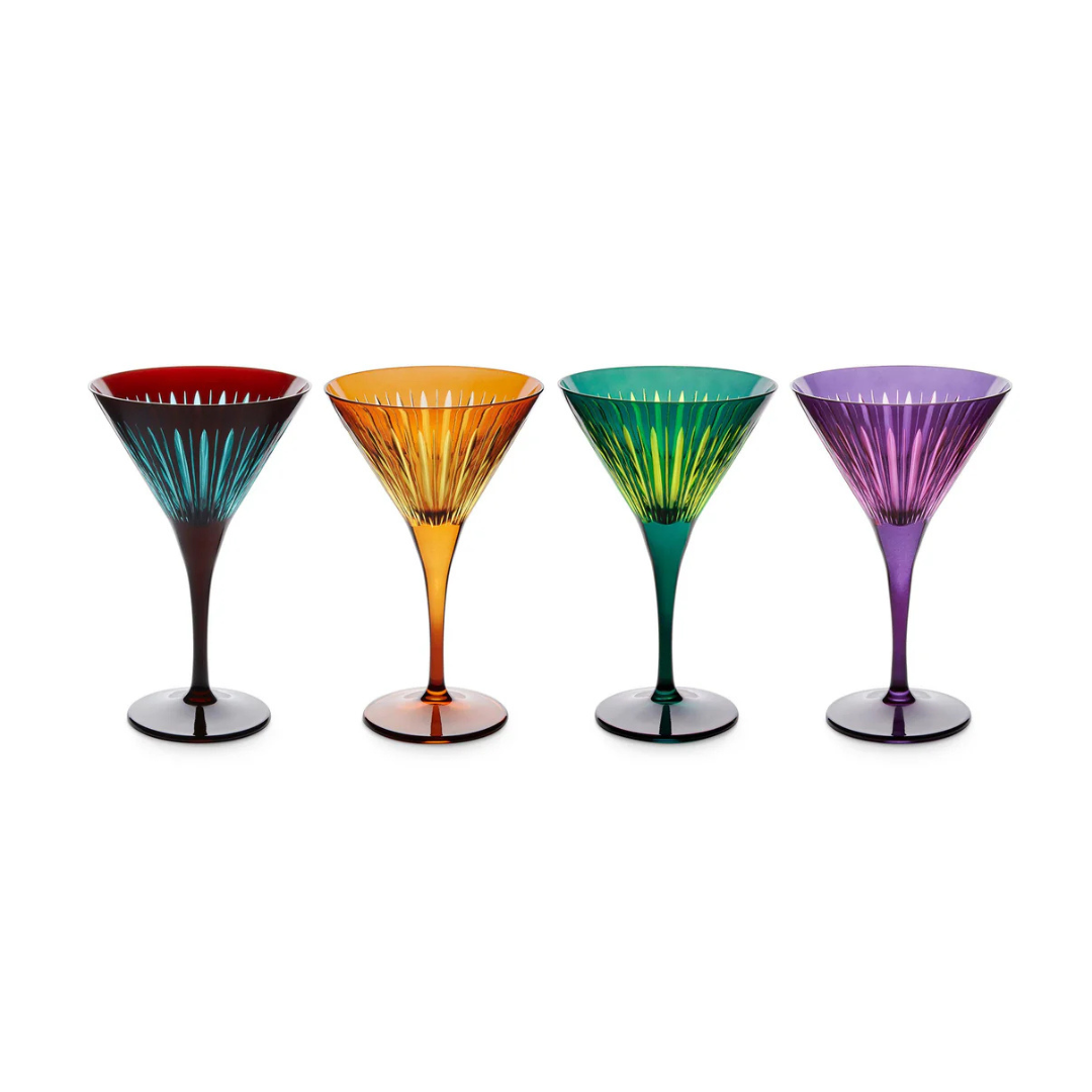 The Prism Martini Set of 4 by L'Objet features bold red, orange, green, and purple glasses with ribbed, radiating patterns, creating a striking glassware collection displayed side by side on a white background.