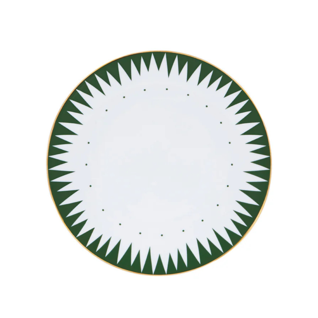 The Molecot Punk Dinnerware Green plate is crafted from white Limoges porcelain, featuring a gold rim and a green geometric sawtooth pattern along the edge.