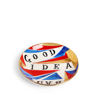 The Good/ - Bad Idea Plate by Ruan Hoffmann for L’Objet features abstract red, blue, white, and gold patterns with "GOOD IDEA" and "BAD" in bold black letters. Part of the Vide Poche Plates collection.