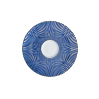 Tresor Dinnerware Blue by Raynaud features a round plate with a white center and a blue rim adorned with a geometric, checkered design. This elegant porcelain piece is shown from above against a white background.