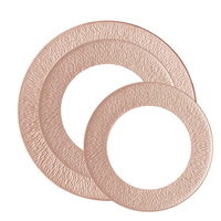 Two round plates with a metallic copper finish overlap on a white background. Featuring wide, decorative rims and a hammered pattern, the Raynaud Mineral Irise Dinnerware set exudes luxurious elegance with its iridescent glaze.