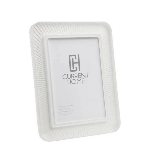 The Rays Frame Snow White by Bella Moulding is a white rectangular photo frame with a subtle ridged texture and modern design, featuring a placeholder image with "Current Home" and a stylized CH logo in the center.