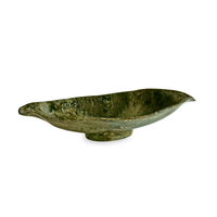 A shallow, oval-shaped Resin Malachite Oval Bowl Green by Beatriz Ball, featuring a textured surface and raised edges, perfect for serving salad, displayed on a white background.