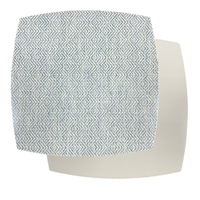 Two overlapping fabric swatches: the top features a blue and white geometric zigzag pattern, inspired by the Ellipse Reversible Placemat Set of 4 - Azure Eggshell by Julian Mejia, layered over a plain off-white textured swatch beneath.