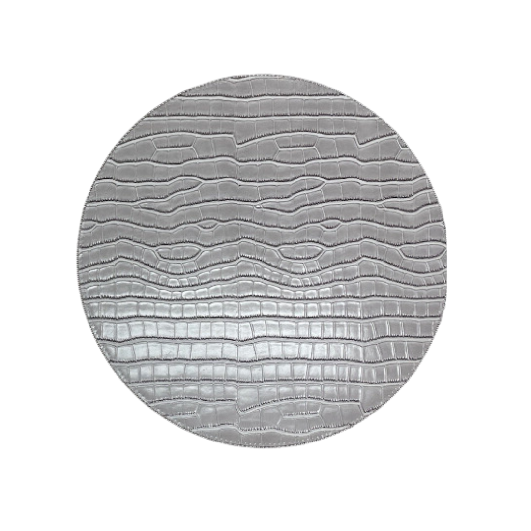 The Julian Mejia Beads Round Reversible Placemat Set of 4 in Hydrangea & Vanilla features a stylish, circular design with raised bead-like textures and a glossy finish—an elegant addition to any table setting.