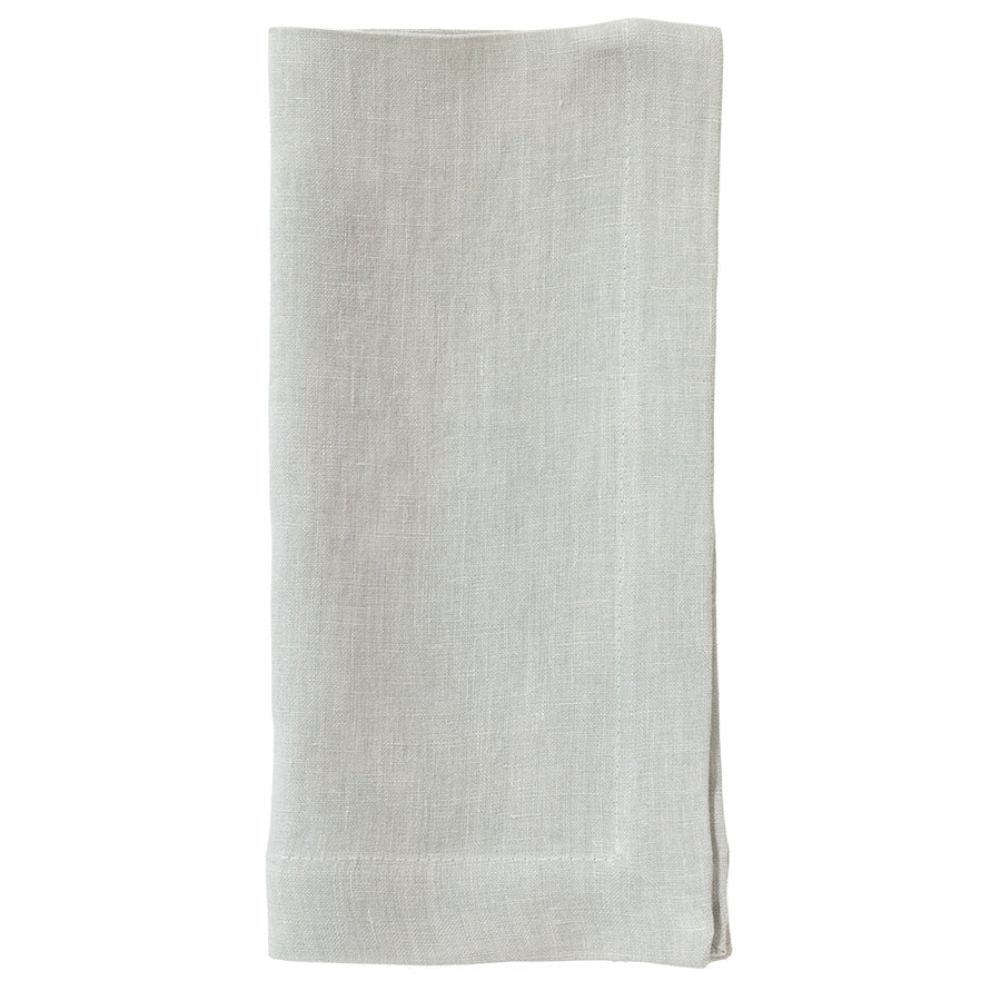 The Bodrum Riviera Napkin Set of 4 features light gray, soft linen napkins with subtle stitched borders, beautifully folded and displayed on a white background—ideal for adding elegance to your everyday table.
