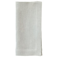 The Bodrum Riviera Napkin Set of 4 features light gray, soft linen napkins with subtle stitched borders, beautifully folded and displayed on a white background—ideal for adding elegance to your everyday table.