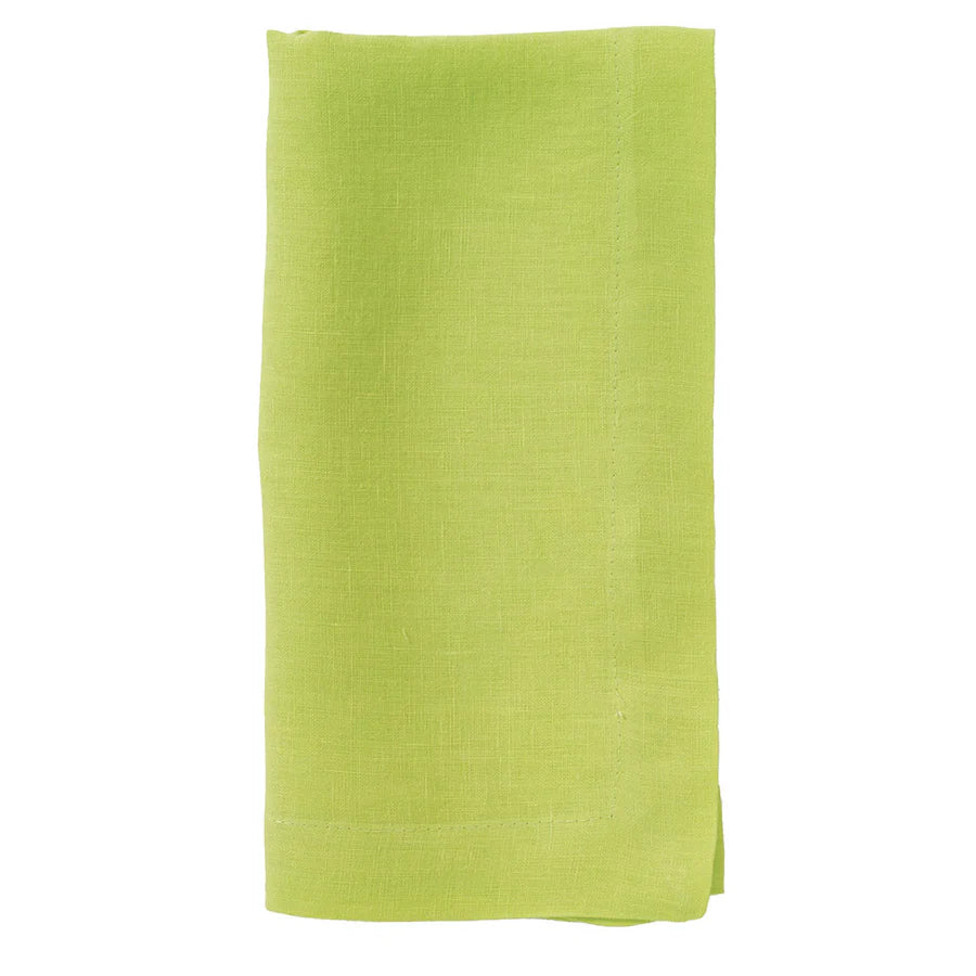 The Bodrum Riviera Napkin Set of 4 features plain, soft linen napkins in light green, neatly folded and displayed against a white background.