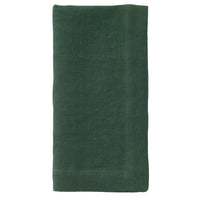 The Bodrum Riviera Napkin Set of 4 features neatly folded, dark green soft linen napkins displayed on a plain white background.