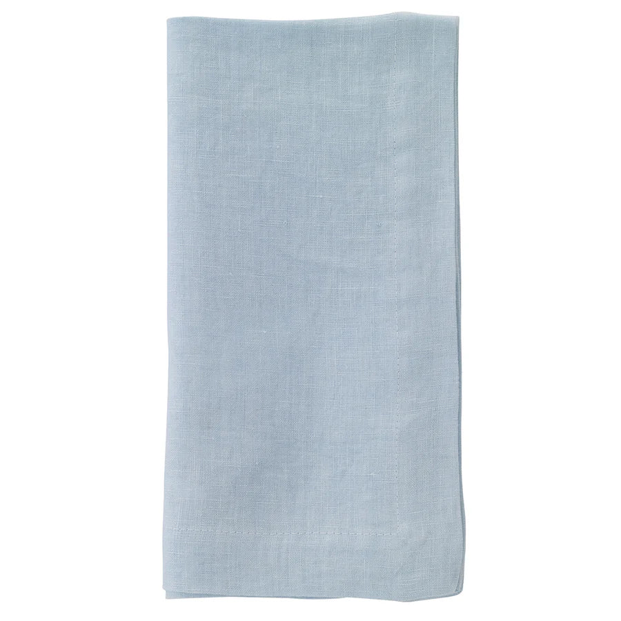 The Bodrum Riviera Napkin Set of 4, featuring light blue stone-washed linen, is neatly folded and displayed against a white background.