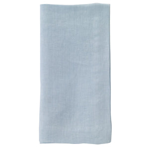The Bodrum Riviera Napkin Set of 4, featuring light blue stone-washed linen, is neatly folded and displayed against a white background.
