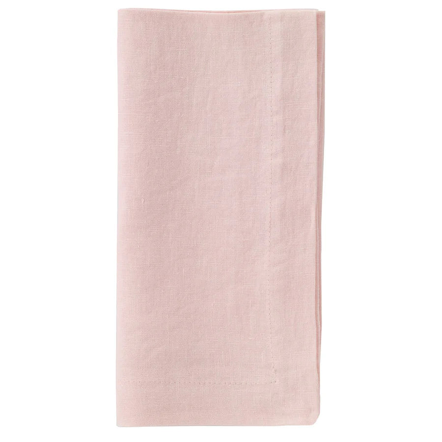 The Bodrum Riviera Napkin Set of 4 features neatly folded, light pink stone-washed linen napkins with visible edge stitching, shown against a plain white background.