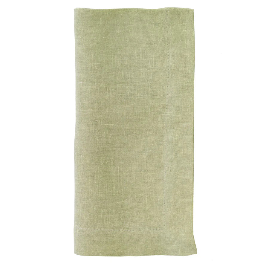 The Bodrum Riviera Napkin Set of 4 features neatly folded, light green stone-washed linen napkins displayed on a white background.