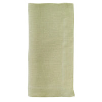 The Bodrum Riviera Napkin Set of 4 features neatly folded, light green stone-washed linen napkins displayed on a white background.