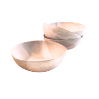 Three stone-hued, round bowls—two stacked and one in front—highlight the artisanal quality of Alex Marshall Studios' Round Ceramic Bowls against a clean white background.