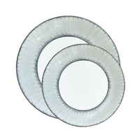 Two round, translucent plates with a textured platinum rim overlap each other on a white background—an exquisite example of Marie Daâge Ruban Dinnerware Platinum Rim, hand-painted from fine Limoges porcelain.