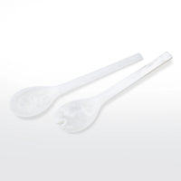 The Nashi Home Swirl Resin Classic Everyday Salad Server Set features two white, marble-patterned resin servers—one spoon and one forked—with elongated handles. Handcrafted and BPA free, they're stylish serveware essentials.