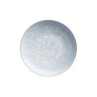 The Song Ocean Dinnerware by Jaune De Chrome is a round, white Limoges porcelain plate featuring a delicate speckled pattern in pale blue and gray. Shown from above against a plain white background, this elegant enamel tableware is both dishwasher and microwave safe, seamlessly combining timeless style with everyday practicality.
