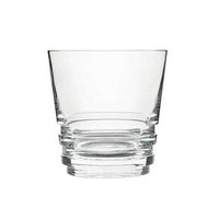 The Oxymore Drinkware by Saint-Louis, a clear glass tumbler with a wide rim and thick, stacked base, is displayed against a plain white background.